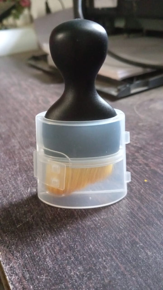 Upright display of the mini car interior cleaning brush.