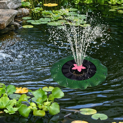 Decorative solar-powered floating water fountain pump placed on water surface