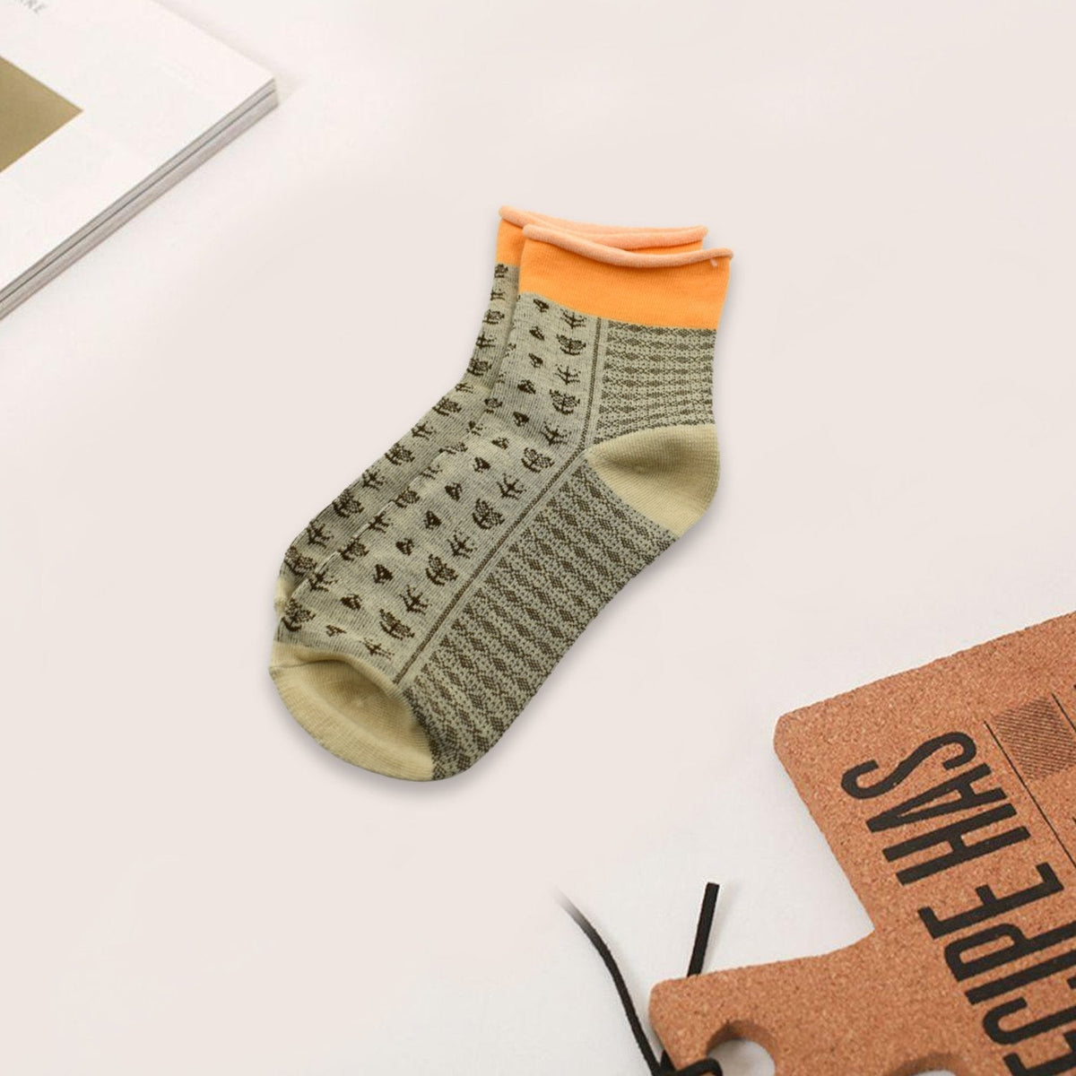 Top-down view of grey cotton ankle socks, perfect for breathable comfort.