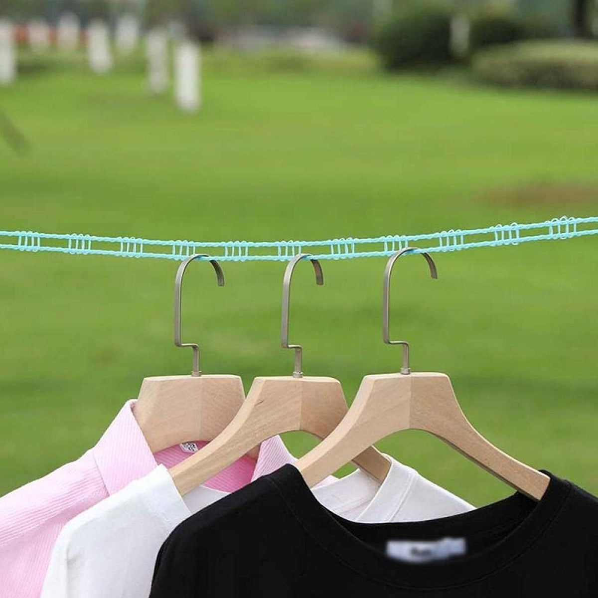 Clothesline rope securely holding clothes outdoors, perfect for camping.