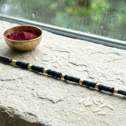 Detailed view of handmade rakhi showcasing intricate bead work