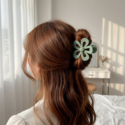 Close-up view of a flower hair claw clip made of durable plastic