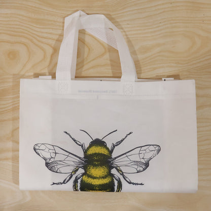 Top view of bee print tote bag showing material and design