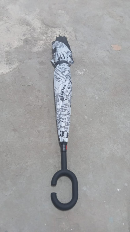 Lifestyle shot of the compact reverse umbrella being carried effortlessly.
