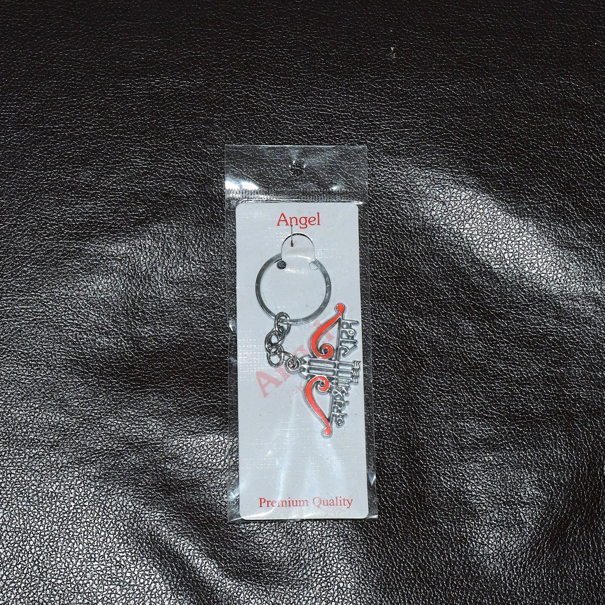 Styled display of Jai Shree Ram devotional metal keychain on vehicle keys